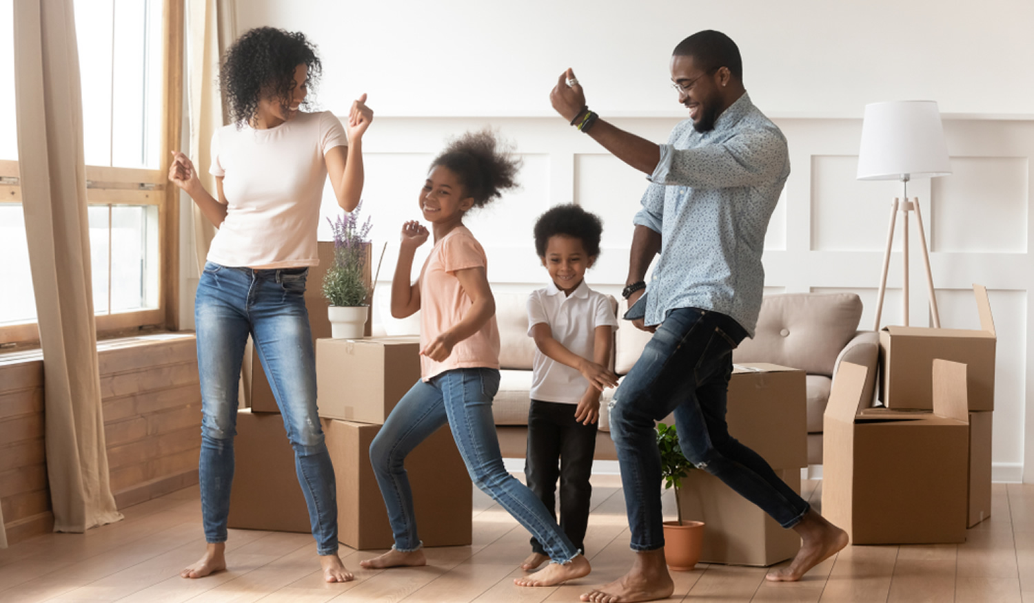 stock photo happy african american parents and cute children dancing among boxes celebrating moving day 1414416173